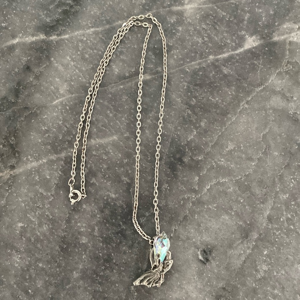 Silver Necklace with Figure Holding a Crystal Pendant